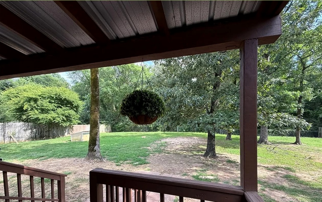Covered deck and fenced backyard